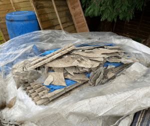 Loose asbestos cement roof sheets for collection and disposal 